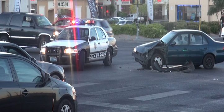 Police Car Next To Crashed Car