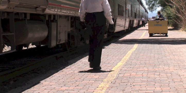 train conductor walking on platform